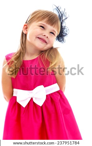 very sweet, romantic little girl in a beautiful dress. Happy childhood, fashion, autumnal mood concept. Isolated on white background