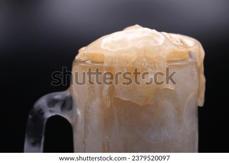 Frozen Root Beer Float Drink in Glass Frosty Mug with Overflowing Foam