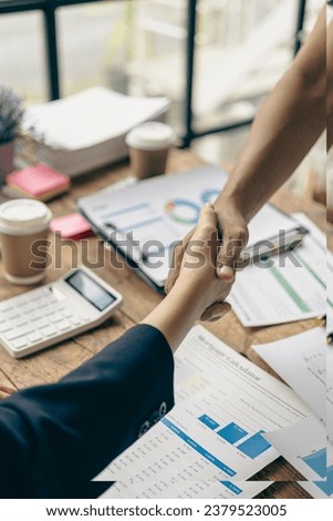 Businessmen join hands for teamwork in business mergers and acquisitions, successful negotiations, with partners celebrating partnership. Close-up pictures