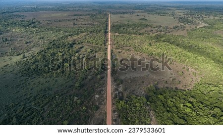 Aerial view of Transpantaneira dirt road crossing straight the North Pantanal Wetlands, Mato Grosso,
