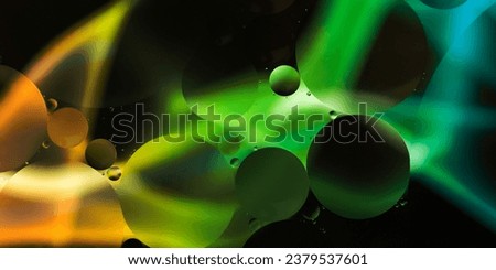 abstract dark background with oil drops on water