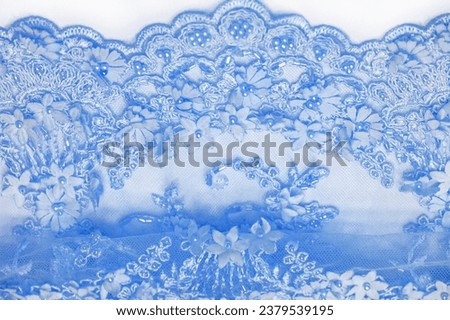 Light blue lace texture background tight design with pale blue stem. Old oil. And sapphire lines Suitable for postcards. Posters. Textures. or wallpaper