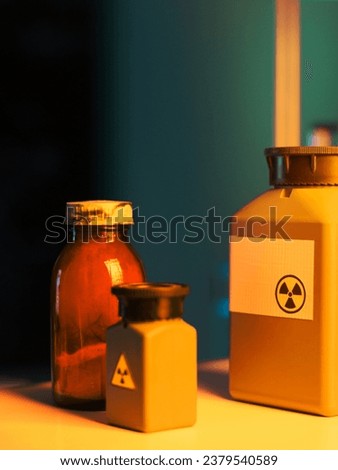 close-up of toxic waste containers placed on a shelf in a laboratory