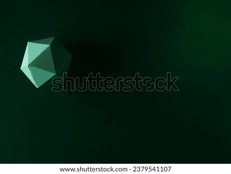 Paper dodecahedron on green background