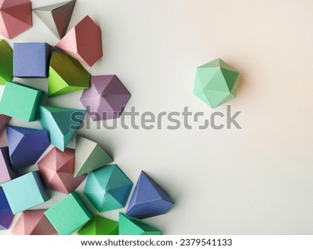 Colorful abstract geometrical composition. Three-dimensional prism pyramid rectangular cube, dodecahedron on white paper background. Geometry models