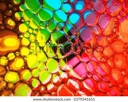 Soap bubbles on a colourful cross-shaped background Royalty-Free Stock Photo #2379541651