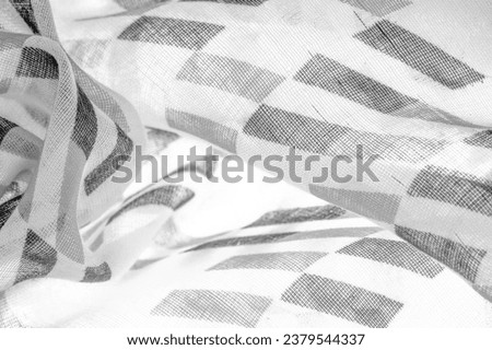 White silk fabric with black geometric rhombus shapes. dark. Background. Template.