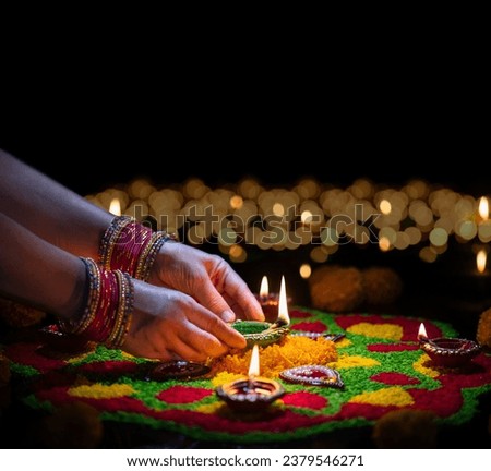 Clay diya lamps lit during diwali celebration, Diwali, or Deepavali, is India's biggest and most important holiday. Royalty-Free Stock Photo #2379546271