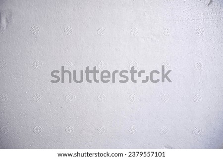 a white wall with stains.