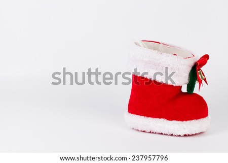 Red Santa's boot with copyspace isolated on white background
