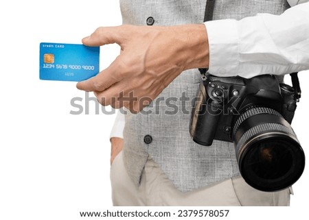 Closeup of male photographer showing his credit card for online payment, contemporary and connected world, where digital transactions have become an integral part of everyday life.