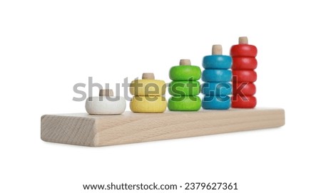 Stacking and counting game wooden pieces isolated on white. Educational toy for motor skills development
