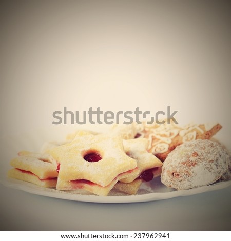 Traditional homemade Christmas cookies on a plate with a pure white background.