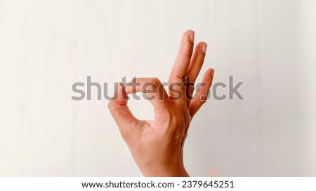 Hand ok sign on white background