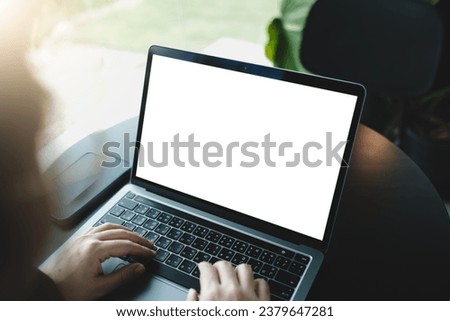 mockup image computer blank screen for hand typing text,using laptop contact business searching information in workplace on desk at office. Royalty-Free Stock Photo #2379647281