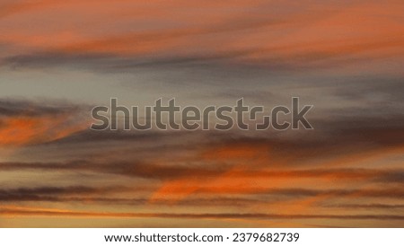 Intense sunset, with orange and purple tons under high altitude Cirrus and Cirrostratus clouds Royalty-Free Stock Photo #2379682739