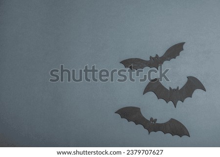 Funny Halloween background. Cute black little bats. Traditional festive symbol, flat lay, classic autumn style, top view