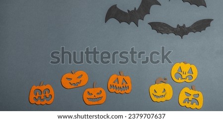 Funny Halloween background. Scary traditional fall pumpkins and flying bats. Festive flat lay, classic autumn style, banner format