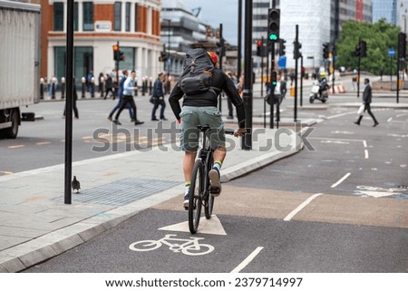 Sporty cyclist on a separate cycle path in London