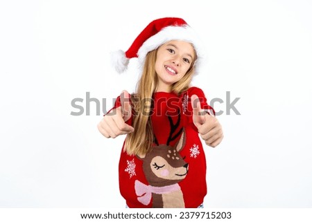 Beautiful girl wearing red knitted sweater approving doing positive gesture with hand, thumbs up smiling and happy for success. Winner gesture.