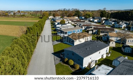 An Aerial View of a Mobile, Modulator, Prefab Home Park, in the Middle of Rural America, on a Sunny Spring Day Royalty-Free Stock Photo #2379716133