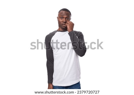 young american man with short haircut dressed in long sleeved casual sweatshirt inspired by idea on isolated white background