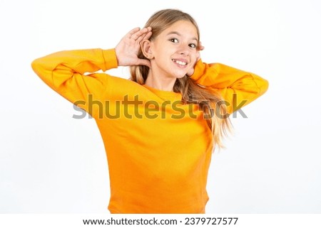 Beautiful teen girl Trying to hear both hands on ear gesture, curious for gossip. Hearing problem, deaf