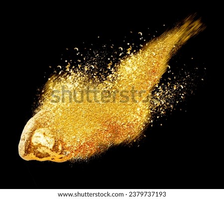 Gold nugget and shiny glitter as comet on black background