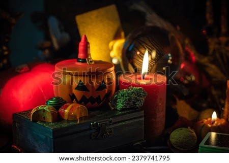 Halloween party, close up magical details including pumpkin and many candles, Home design 