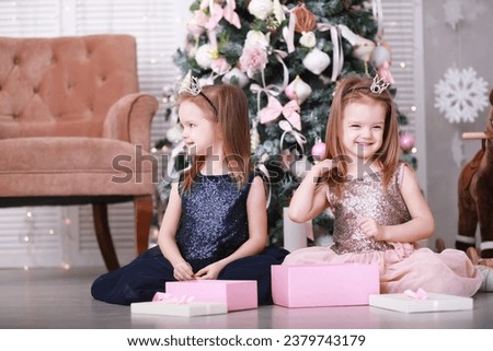 Christmas Family with Kids opening Christmas gifts. Christmas Tree.