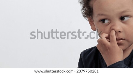 boy picking his nose with people on white background stock image stock photo