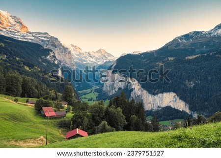 Beautiful view from Wengen mountain village and Lauterbrunnen valley with Jungfrau mountain in the evening at Bern, Switzerland