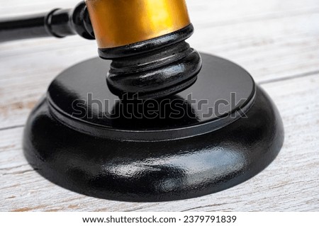 Close up of gavel on wooden cover background. Copy space and law concept.