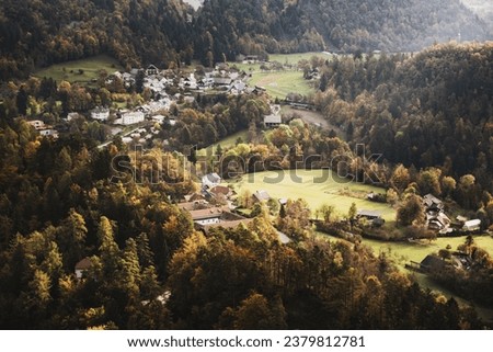 Rural autumn landscape with the village and forest near lake Bled in Slovenia, natural seasonal background