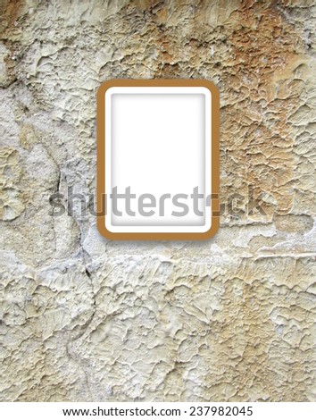 Brown picture frame on scratched wall background