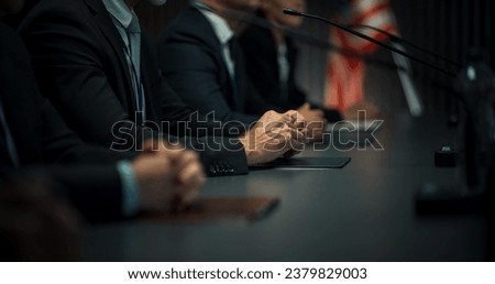 Close Up On Hands of Caucasian Male Organization Representative Speaking at Economic Conference. Head Of USA Delegation Delivering Speech at International Political Summit, Delegates Listening. Royalty-Free Stock Photo #2379829003