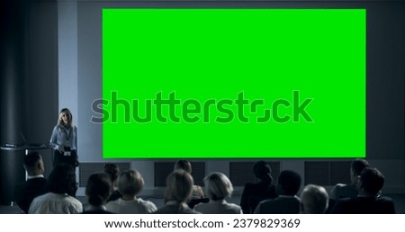 Corporate Event: Caucasian Female Tech CEO Giving Presentation On Green Screen Chromakey Projector Display To Colleagues In Conference Room Of Startup Office. Woman Talking About Business Objectives.