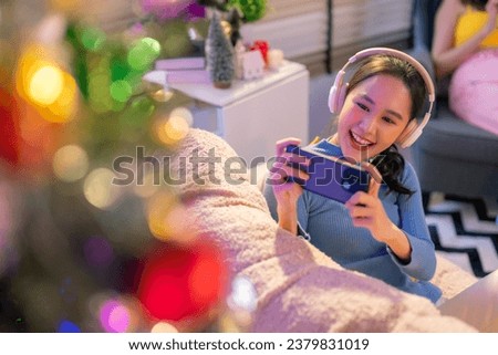 happiness young adult asian teen woman capture wonderful moment beautiful decorative christmas tree decorate for her social account for share and post woman taking chrsitmas tree photo