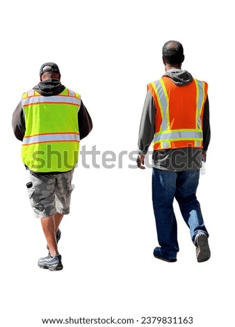 Cut out to two male road construction workers walking down the street wearing reflective special clothing. Rear view of maintenance crew in brightly colored orange and lettuce work vests. City service Royalty-Free Stock Photo #2379831163