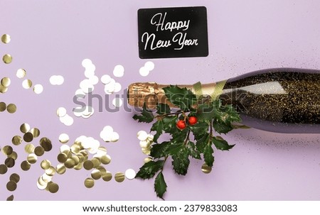 Champagne bottle with confetti on violet background. Christmas, birthday or wedding concept. Flat lay.