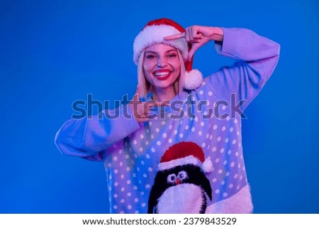 Portrait of attractive positive person toothy smile arms fingers show cadre focus gesture isolated on blue color neon background