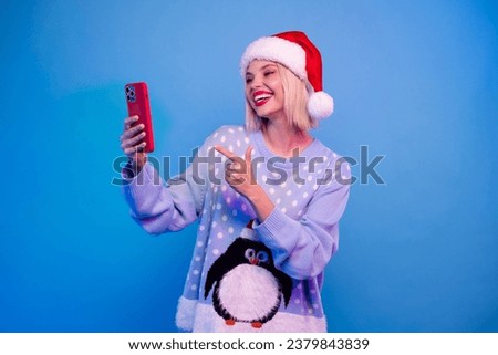 Photo of cheerful charming girl wear trendy penguin ornament jumper speaking online video call isolated blue color neon light background