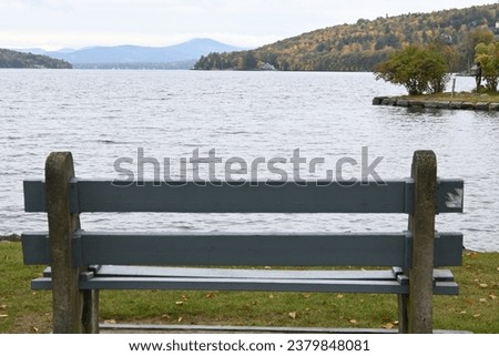 Bench by rural New England pond in mountains