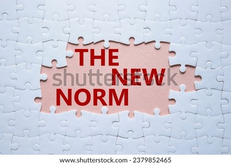 The new norm symbol. Concept words The new norm on white puzzle. Beautiful pink background. Business and The new norm concept. Copy space. Royalty-Free Stock Photo #2379852465