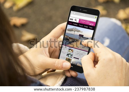 mobility and modern lifestyle concept: young woman reading a trends blog at the park Royalty-Free Stock Photo #237987838