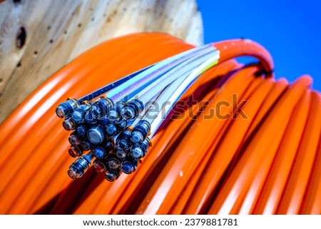 glass fibre cable on a drum - closeup Royalty-Free Stock Photo #2379881781