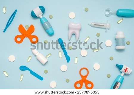 Various healthcare and medical accessories on a blue background. Flat lay