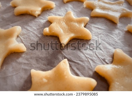 Unbaked star cookies stock photo. Dough shaped into star cookies. Chanukah themed cookies- Magen David. Close up.