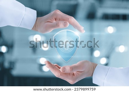 Concept of health protection and support. The doctor hands are protected by a shield with a cross gesture.