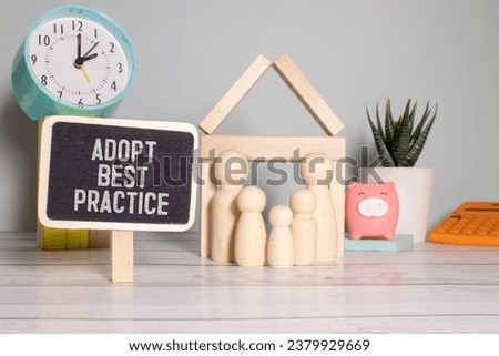 a young family and an Adopt Best Practice sign. Royalty-Free Stock Photo #2379929669